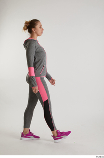  Mia Brown  1 dressed grey hoodie grey leggings pink sneakers side view sports walking whole body 0001.jpg